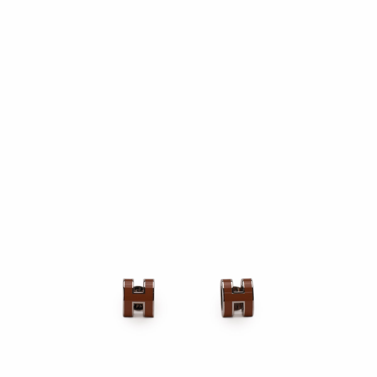 Brown enamel Hermès H stud earrings, curated Pre-loved Luxury by Myluxe in Helsinki.