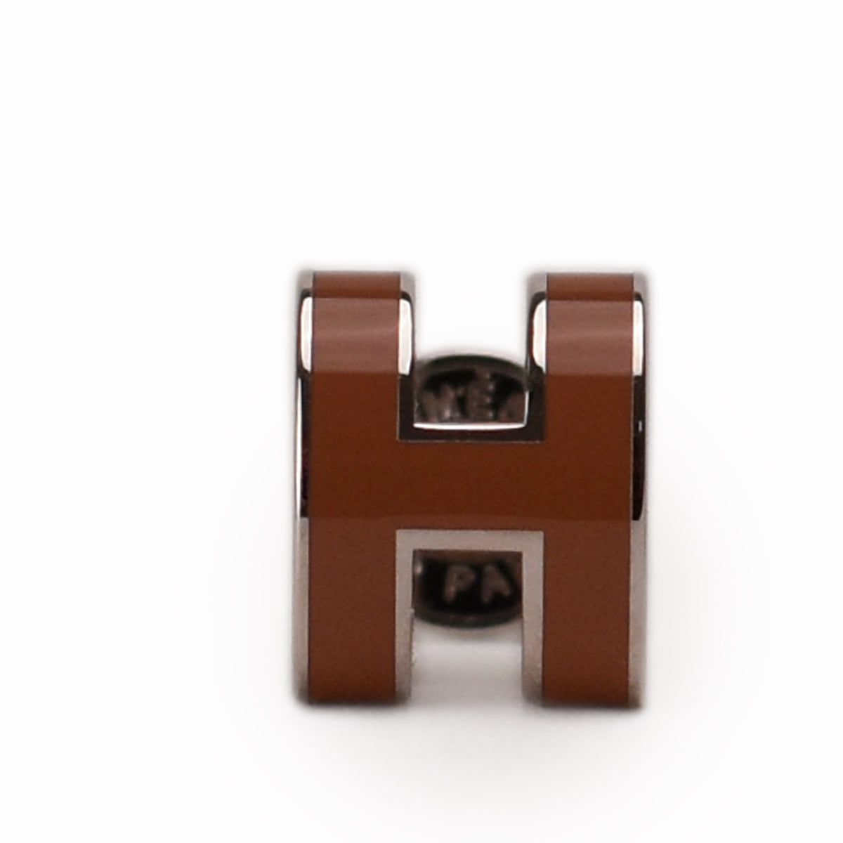 Brown leather and silver-tone Hermès H stud earring, curated Pre-loved Luxury by Myluxe in Helsinki.