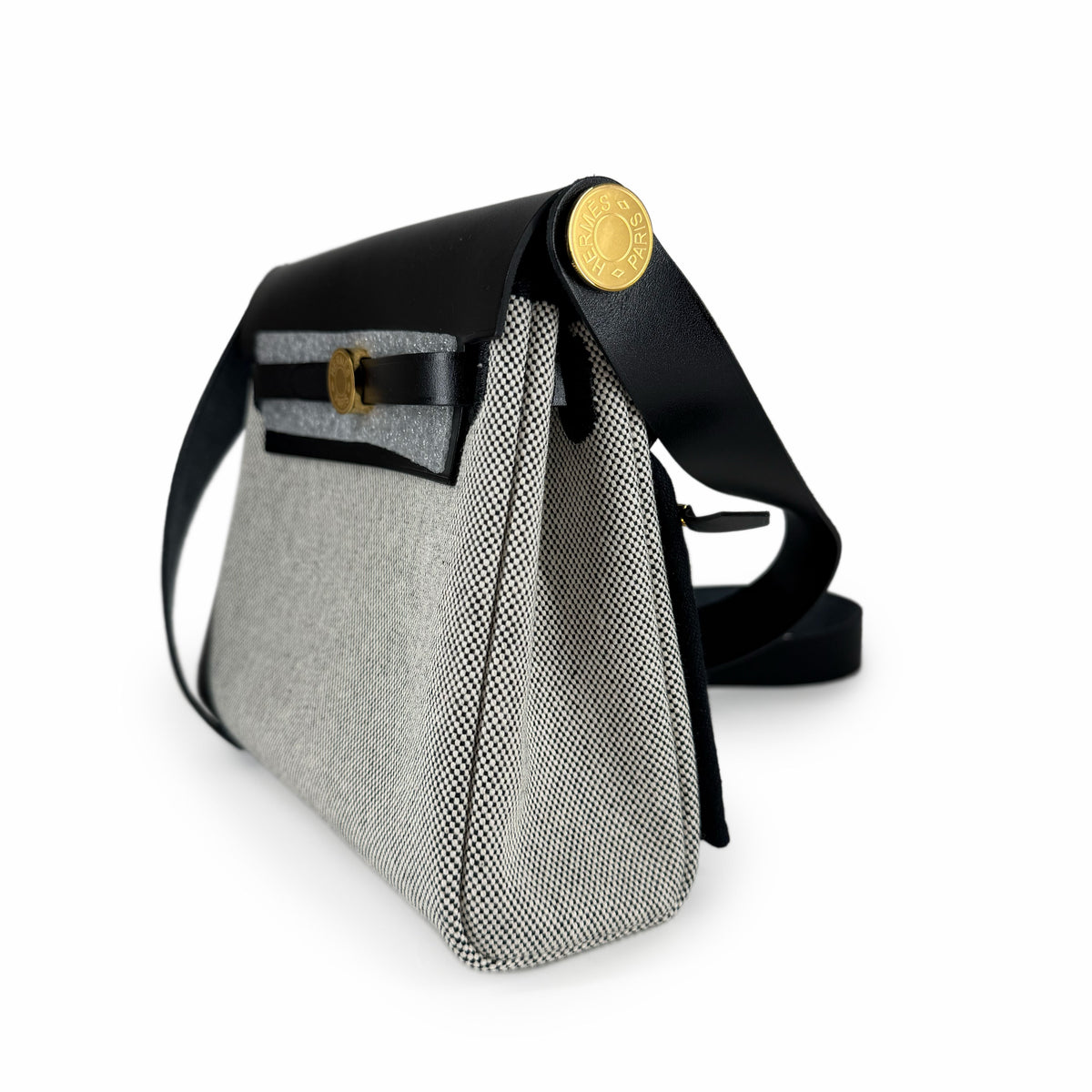 Black and grey textured fabric crossbody bag with gold hardware, curated Pre-loved Luxury by Myluxe in Helsinki.