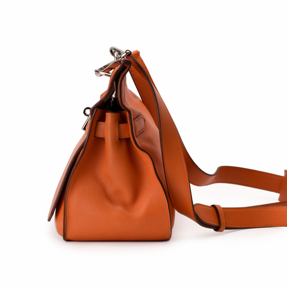 Hermès orange leather handbag with adjustable strap, curated Pre-loved Luxury by Myluxe in Helsinki.