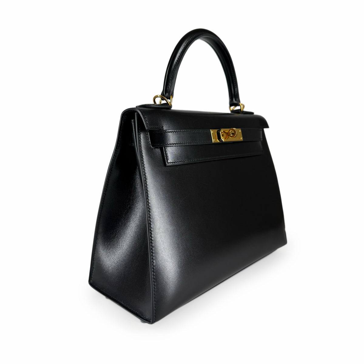 Black leather designer top handle handbag with gold-tone hardware, curated Pre-loved Luxury by Myluxe in Helsinki.