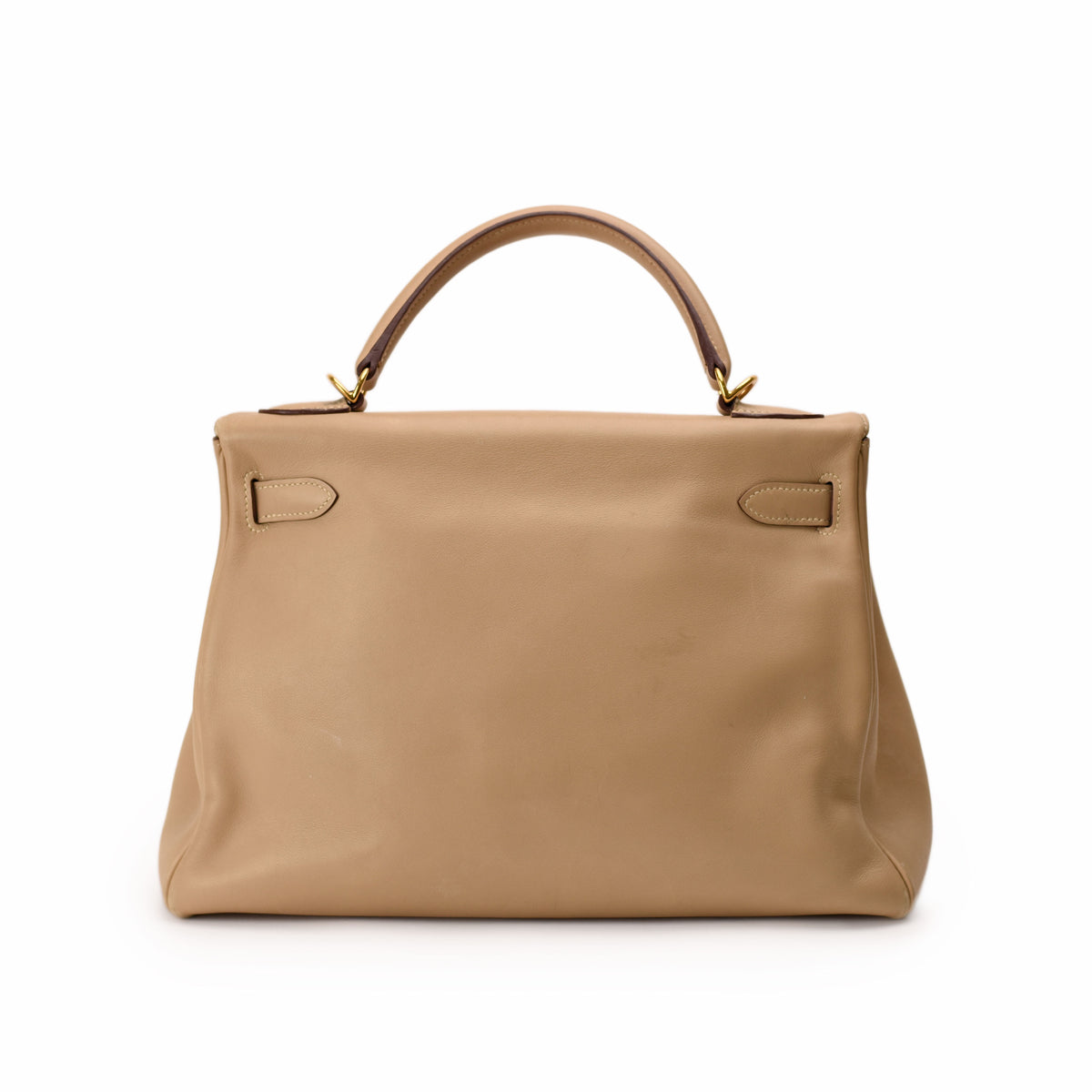 Beige leather Hermès handbag with top handle, curated Pre-loved Luxury by Myluxe in Helsinki.