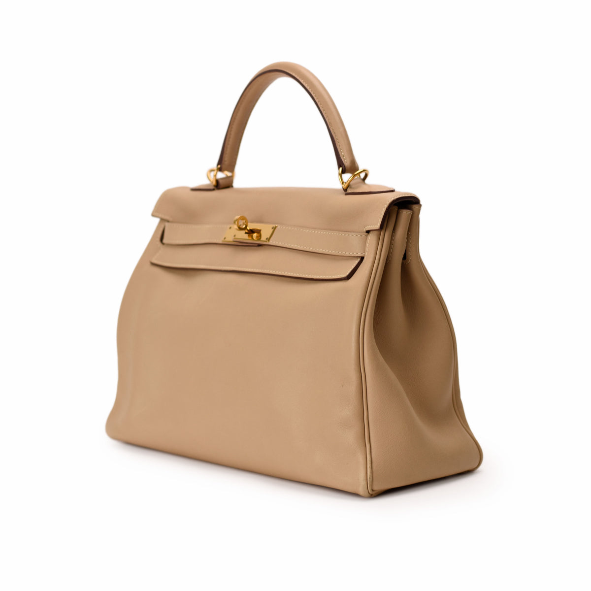 Taupe leather Hermès Kelly handbag with gold-tone hardware, curated Pre-loved Luxury by Myluxe in Helsinki.