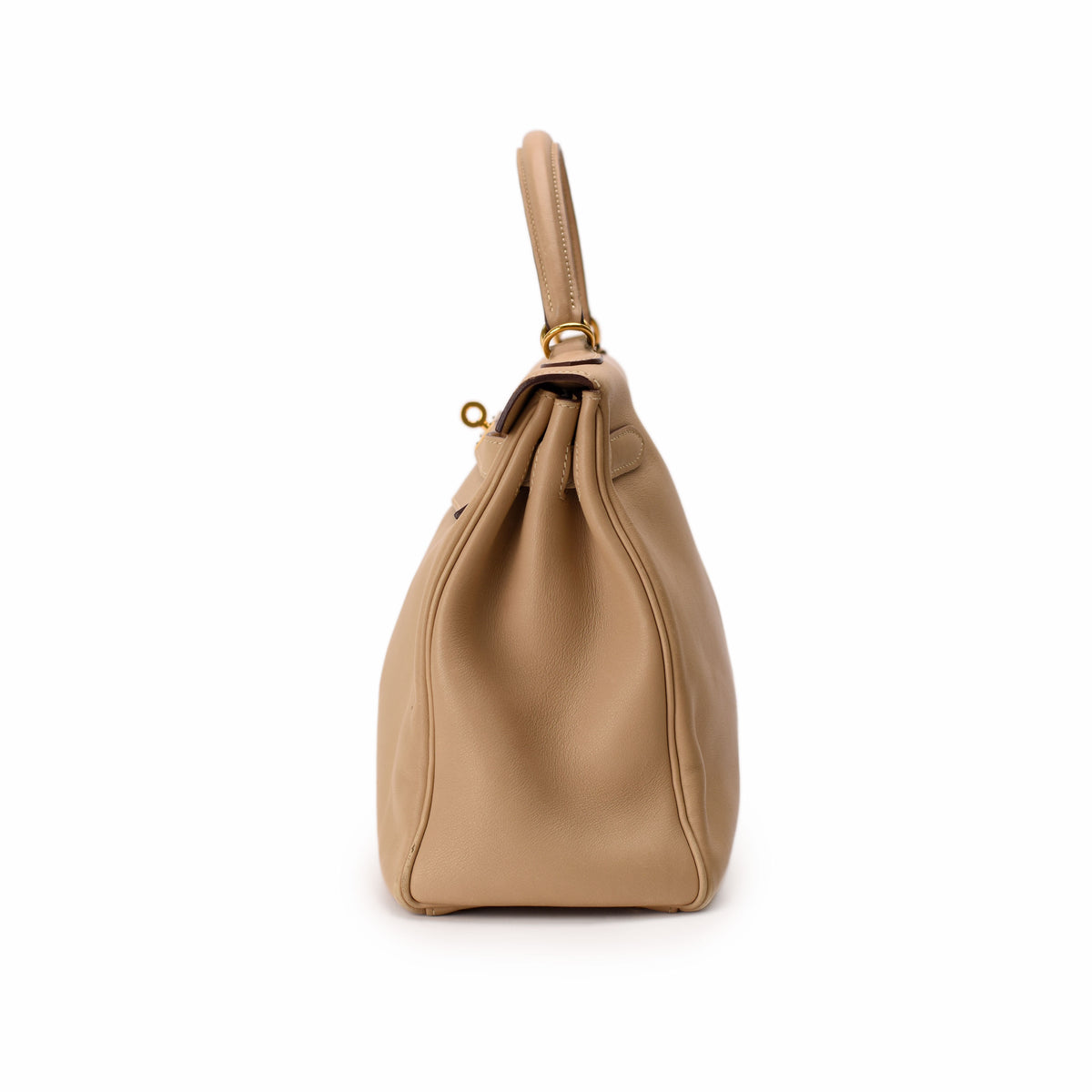 Beige leather designer handbag with gold-tone hardware, curated Pre-loved Luxury by Myluxe in Helsinki.
