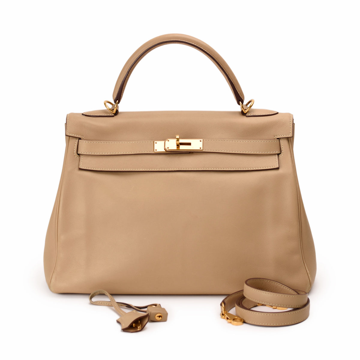 Taupe leather Hermès Kelly bag with gold hardware, curated Pre-loved Luxury by Myluxe in Helsinki.