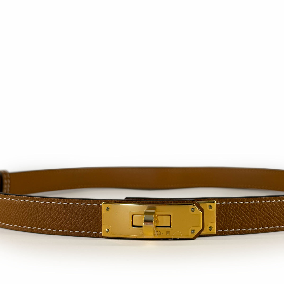 Tan leather belt with a gold-toned rectangular buckle, curated Pre-loved Luxury by Myluxe in Helsinki.