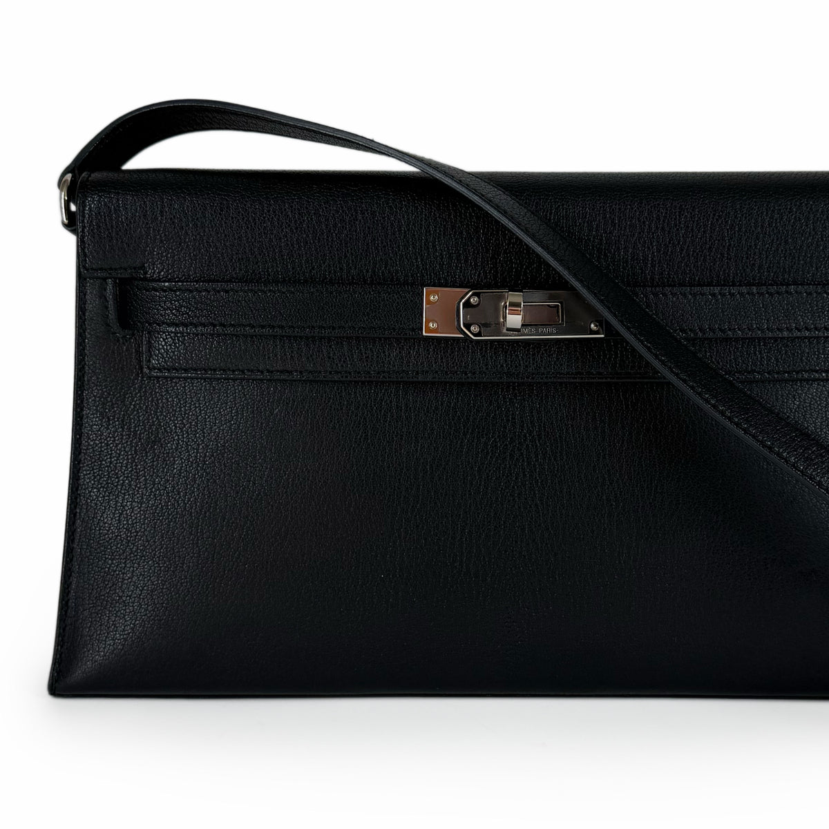 Black grained leather designer clutch with silver metal hardware, curated Pre-loved Luxury by Myluxe in Helsinki.