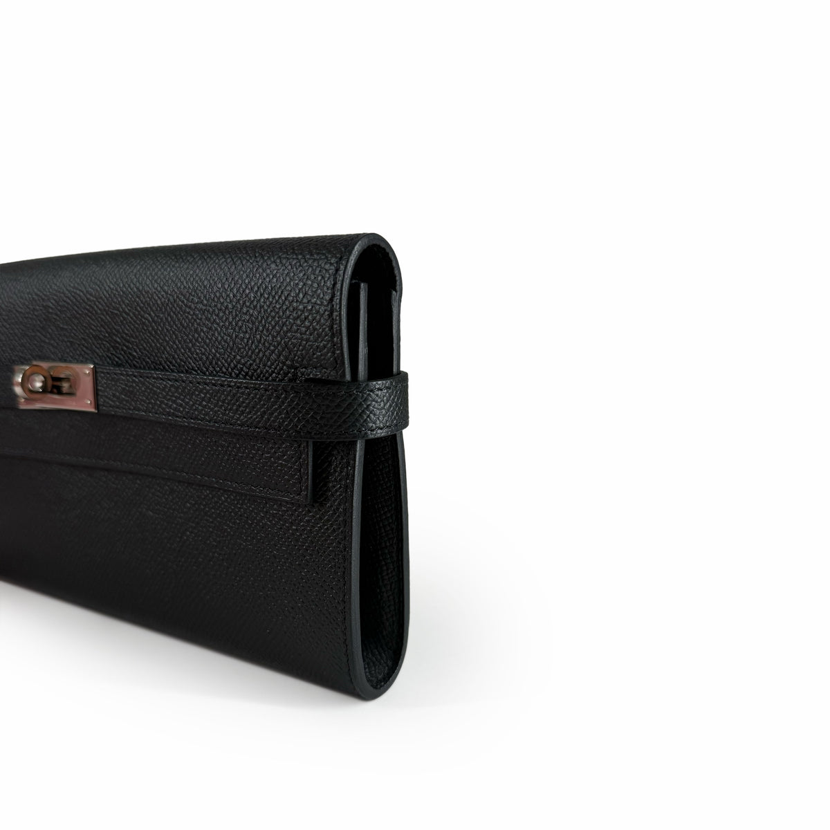 Black grained leather clutch with a rose gold metal clasp, curated Pre-loved Luxury by Myluxe in Helsinki.