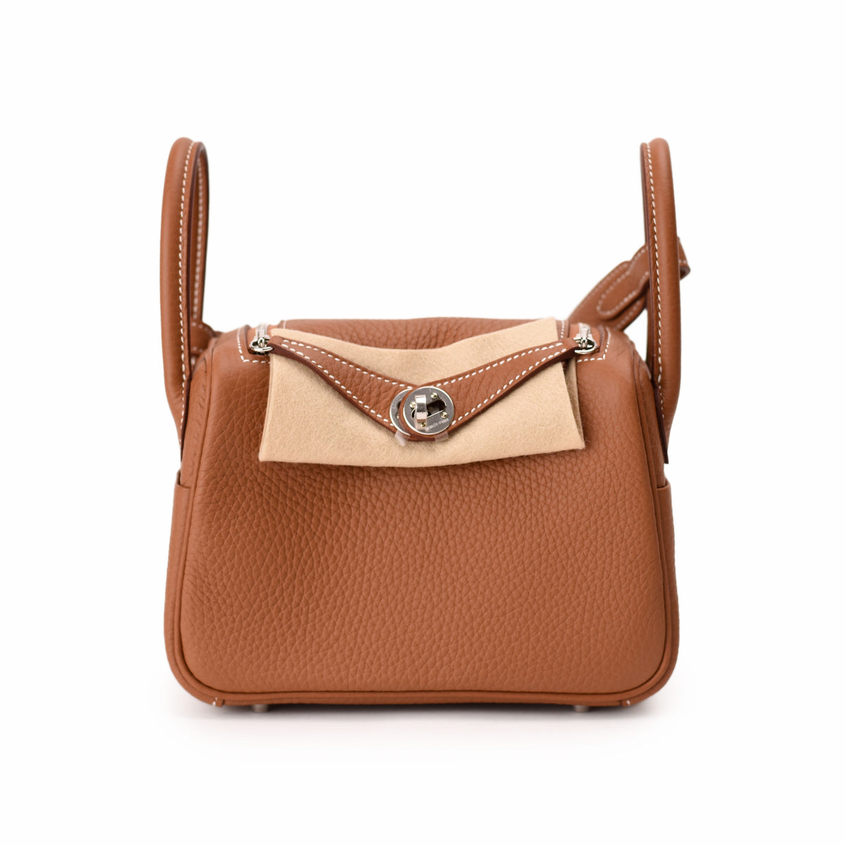 Brown grained leather handbag with a beige fold-over flap and silver clasp, curated Pre-loved Luxury by Myluxe in Helsinki.