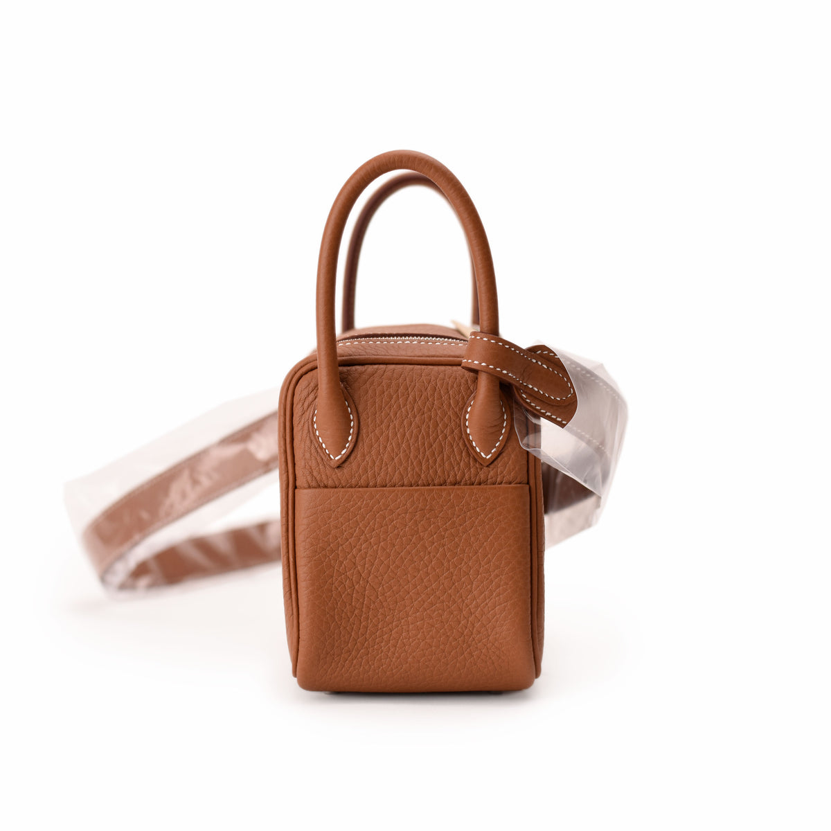 Brown pebbled leather mini handbag with top handle and strap, curated Pre-loved Luxury by Myluxe in Helsinki.