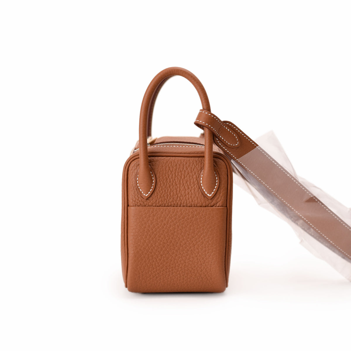 Tan pebbled leather mini top handle bag with white stitching. curated Pre-loved Luxury by Myluxe in Helsinki.