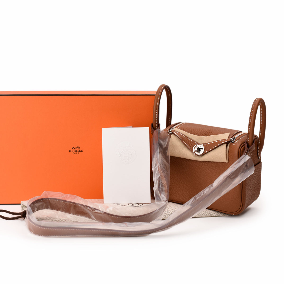 Hermès brown leather crossbody bag with tan flap and silver hardware. curated Pre-loved Luxury by Myluxe in Helsinki.