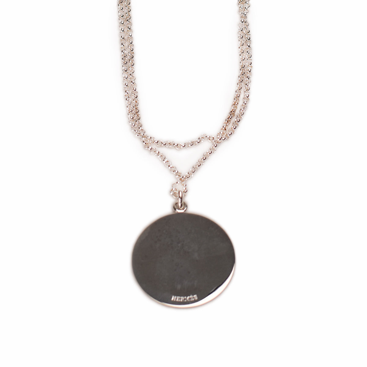Hermès silver-toned round pendant necklace on a delicate chain. curated Pre-loved Luxury by Myluxe in Helsinki.