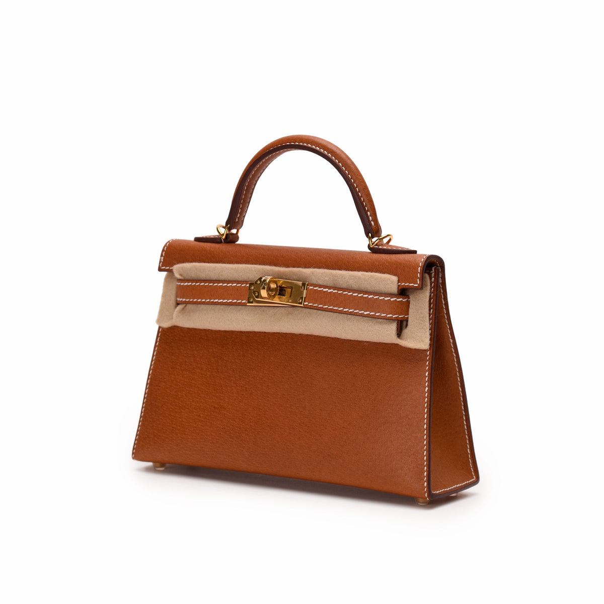Tan leather top handle handbag with gold-tone hardware, curated Pre-loved Luxury by Myluxe in Helsinki.