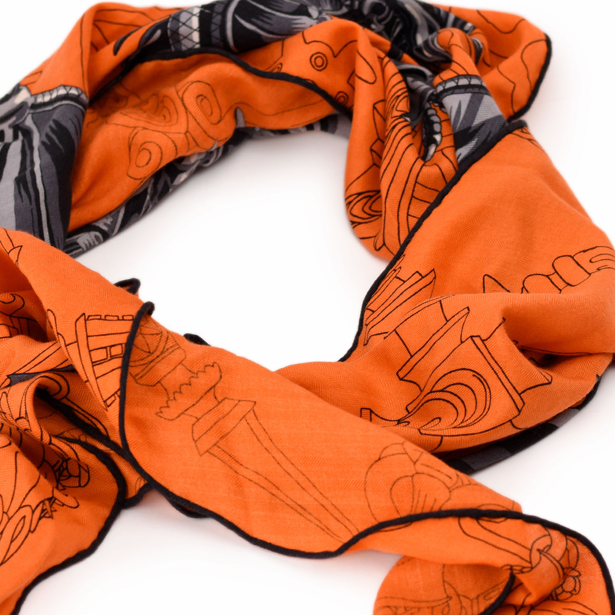 Orange silk scarf with black illustrated patterns, curated Pre-loved Luxury by Myluxe in Helsinki.
