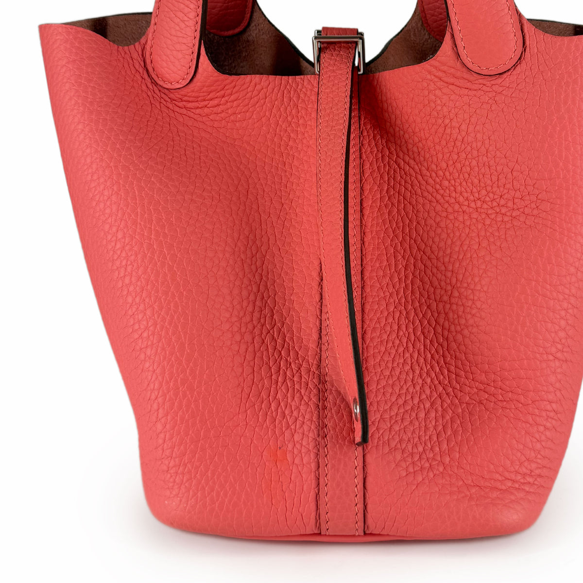 Coral pink pebbled leather tote bag with silver buckle detail, curated Pre-loved Luxury by Myluxe in Helsinki.