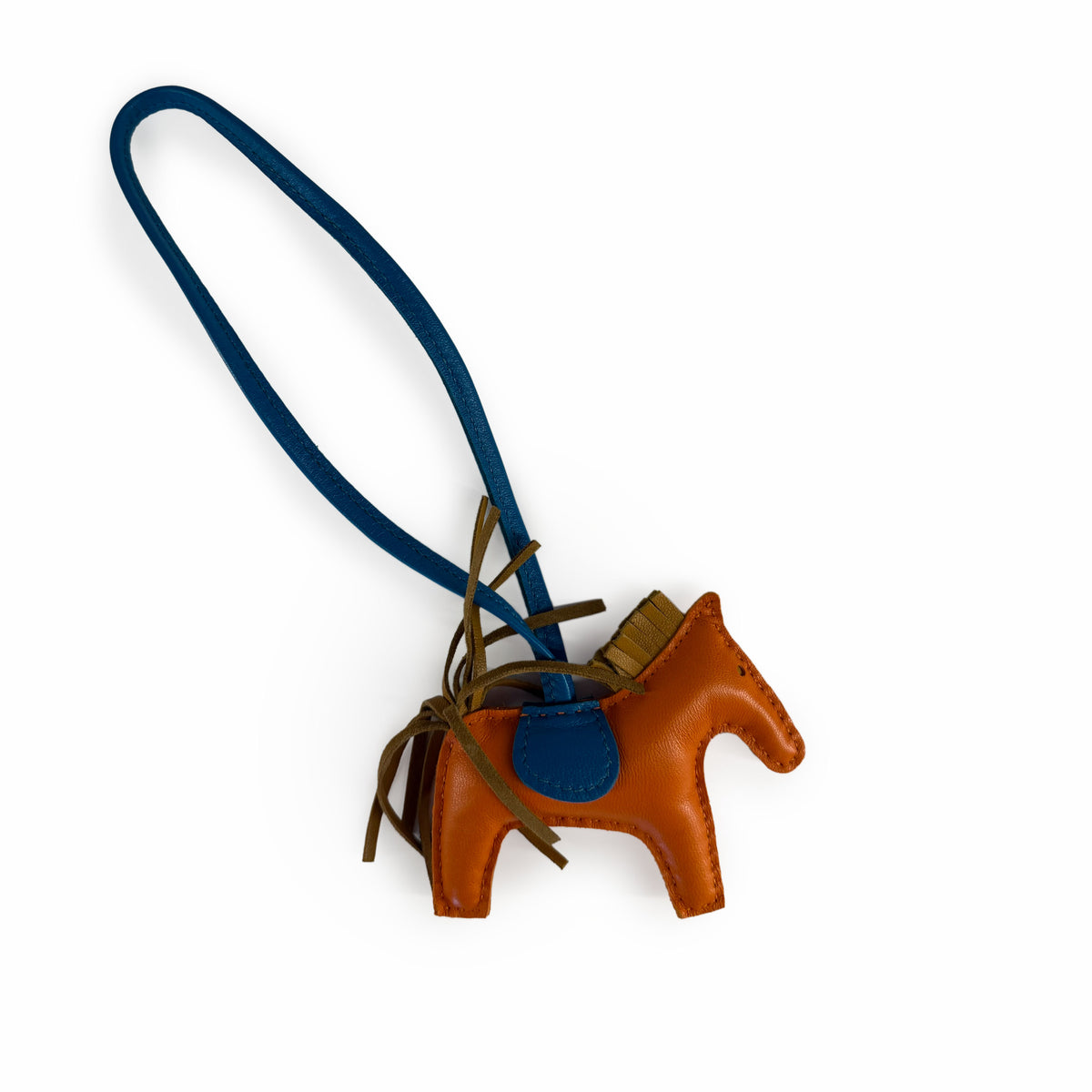 Brown leather horse keychain with a blue strap, curated Pre-loved Luxury by Myluxe in Helsinki.