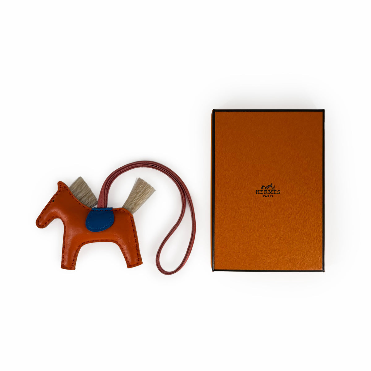 Hermès brown leather horse charm with tan hair details, curated Pre-loved Luxury by Myluxe in Helsinki.
