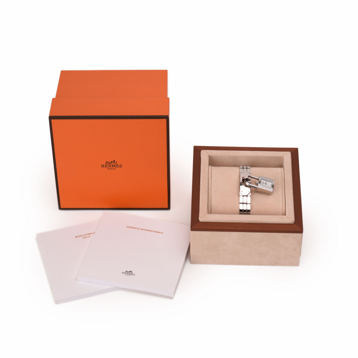 Hermès silver stainless steel watch in orange box with authenticity papers. curated Pre-loved Luxury by Myluxe in Helsinki.