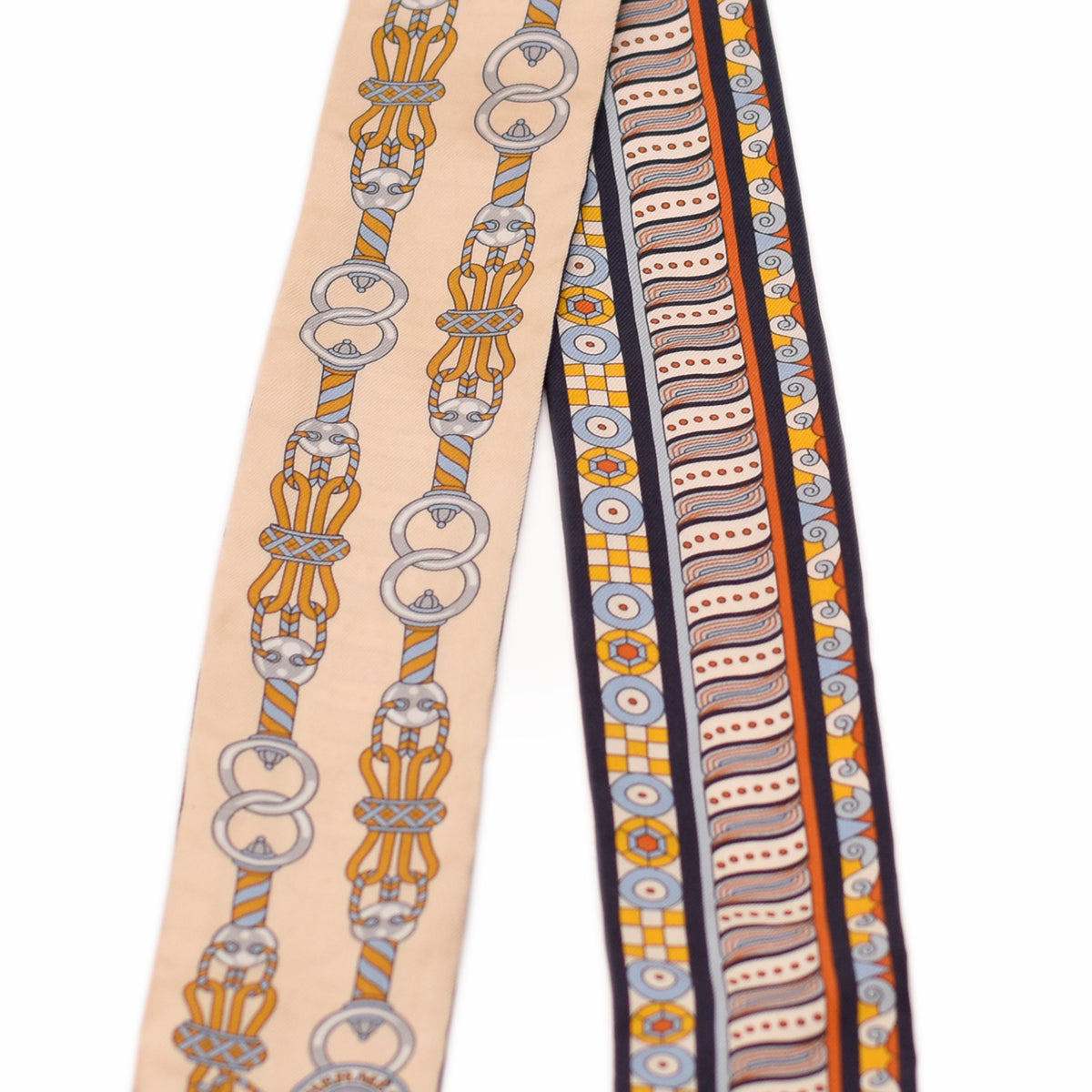 Silk patterned scarf with gold chain and geometric motifs in beige and navy. curated Pre-loved Luxury by Myluxe in Helsinki.