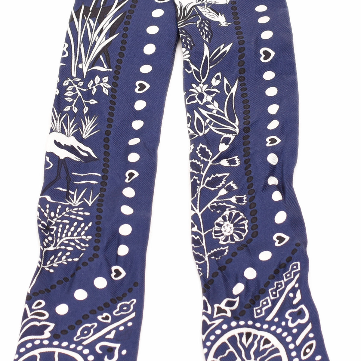 Blue silk scarf with white floral and botanical patterns. curated Pre-loved Luxury by Myluxe in Helsinki.