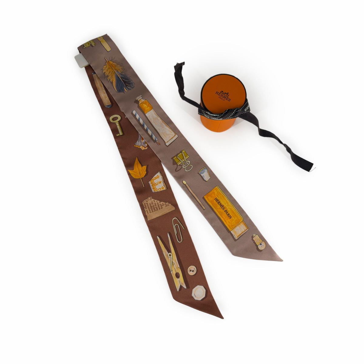 Hermès silk scarf with vintage-style illustrations in brown and taupe, curated Pre-loved Luxury by Myluxe in Helsinki.