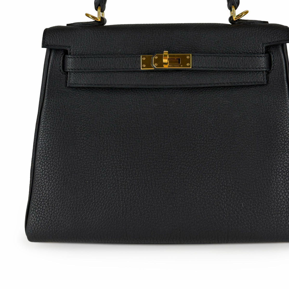 Black grained leather handbag with gold-tone hardware, curated Pre-loved Luxury by Myluxe in Helsinki.