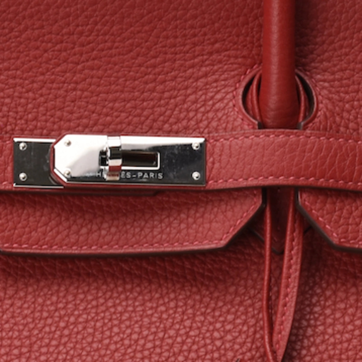 Close-up of Hermès Birkin 35 in Rouge Casaque Clemence leather with PHW hardware. curated Pre-loved Luxury by Myluxe in Helsinki.