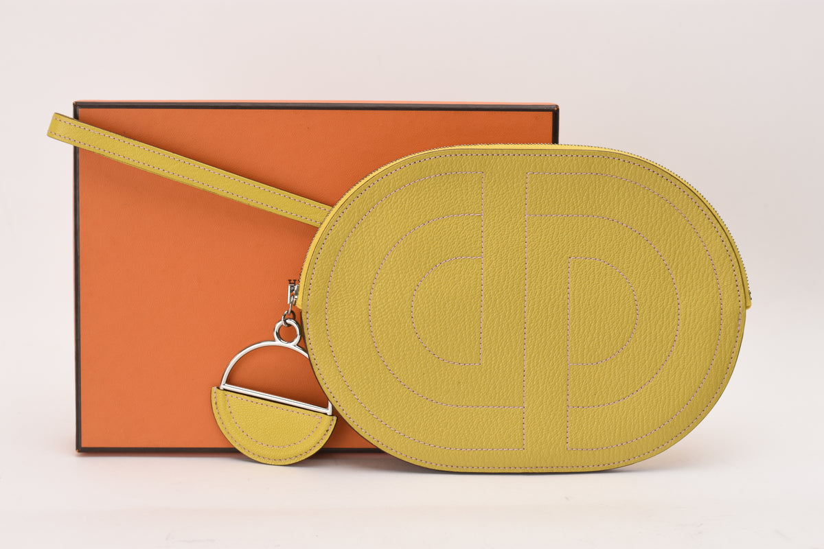 Hermès In-the-Loop To Go pouch in Jaune De Naples yellow leather with Mauve Sylvestre accent. curated Pre-loved Luxury by Myluxe in Helsinki.