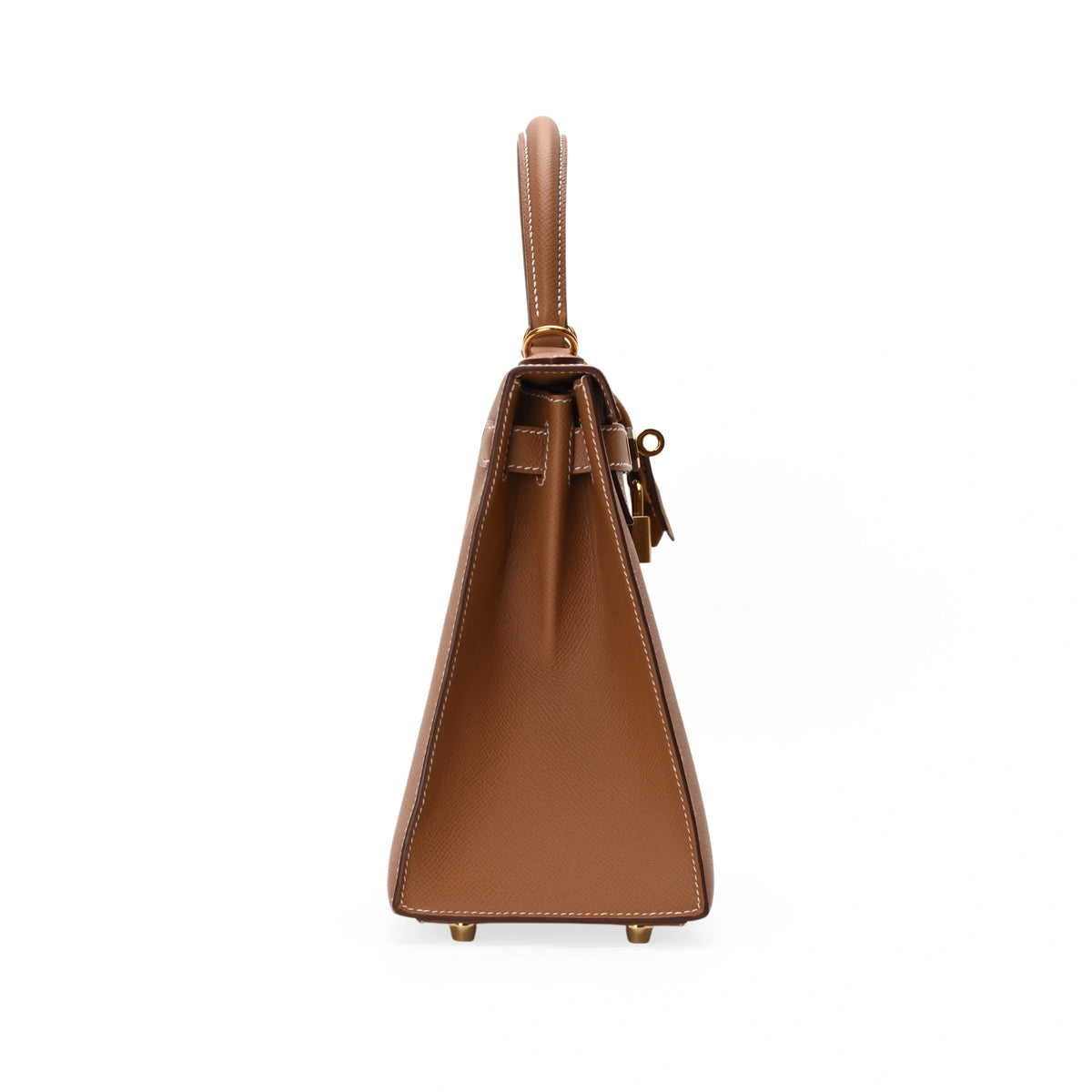 Side view of a brown leather Hermès handbag with gold hardware, curated Pre-loved Luxury by Myluxe in Helsinki.