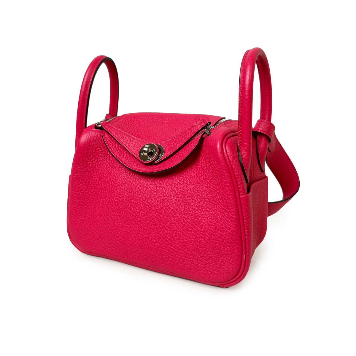 Pink pebbled leather handbag with circular gold hardware, curated Pre-loved Luxury by Myluxe in Helsinki.