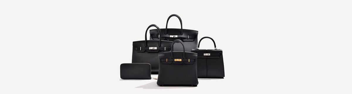 Collection of luxury black leather designer handbags and a small wallet.
