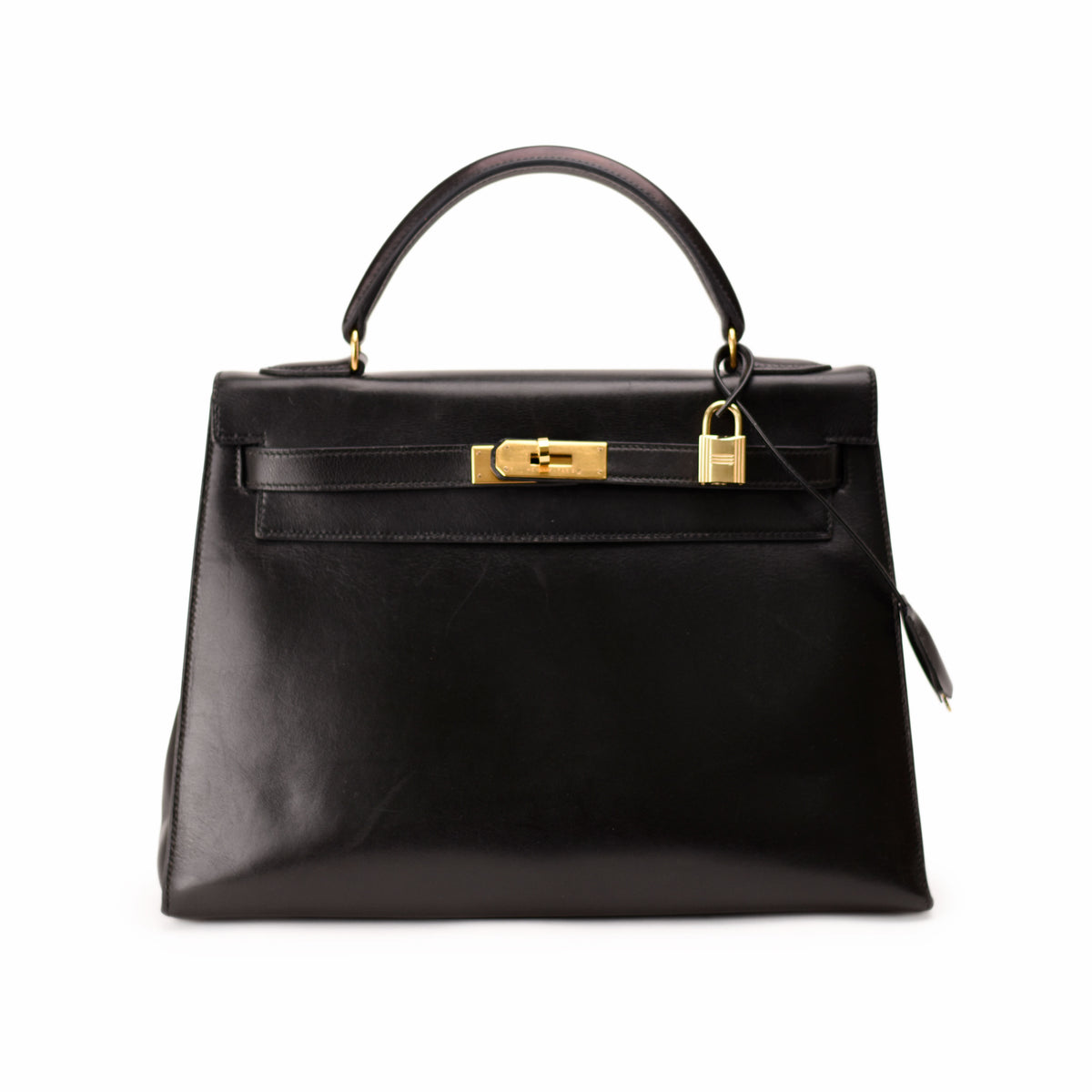 Black leather Hermès handbag with gold-tone hardware. curated Pre-loved Luxury by Myluxe in Helsinki.