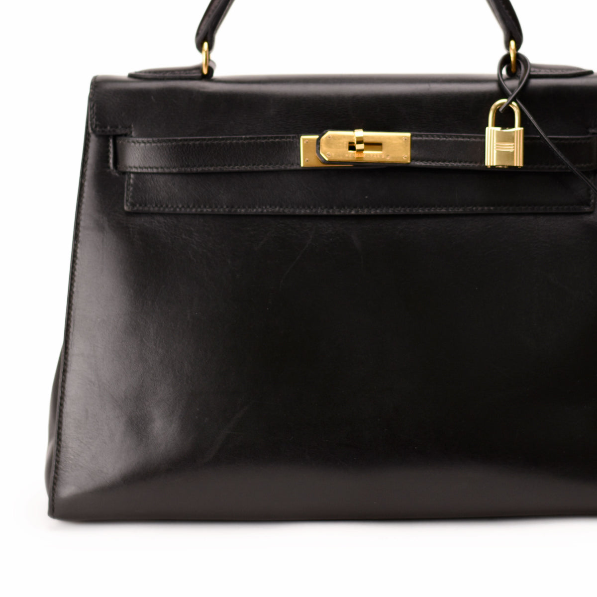 Black leather Hermès handbag with gold-tone hardware. curated Pre-loved Luxury by Myluxe in Helsinki.