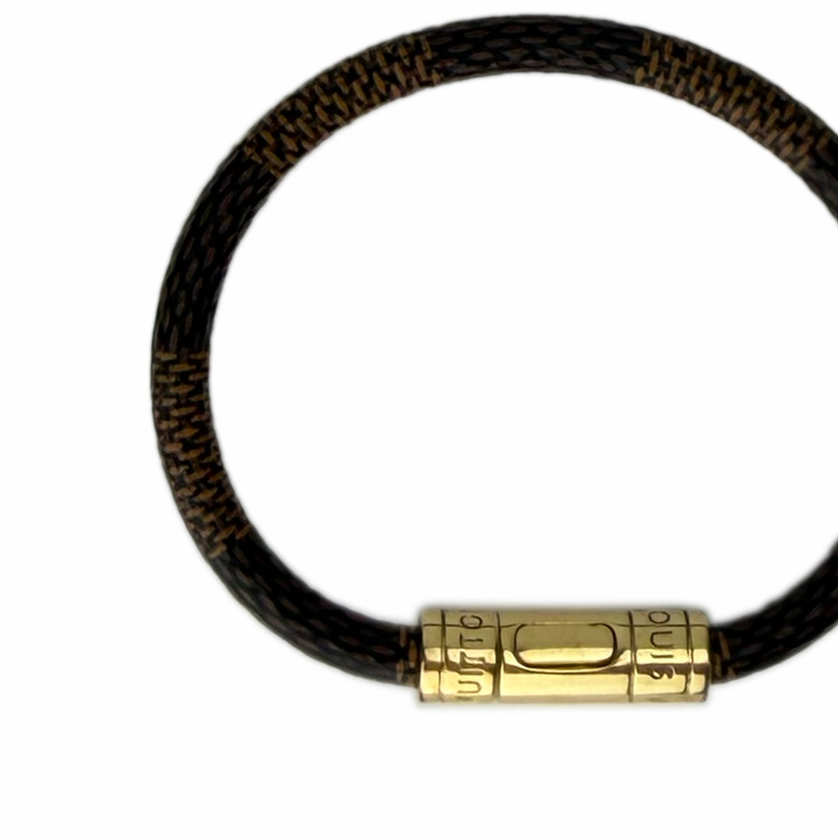 Brown woven leather bracelet with a gold-tone clasp, curated Pre-loved Luxury by Myluxe in Helsinki.