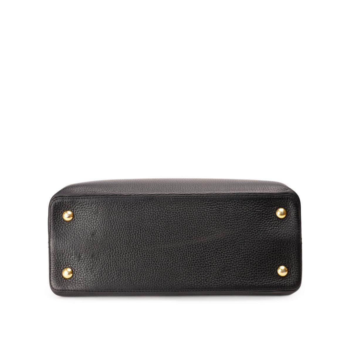 Bottom view of a black grained leather handbag with gold-tone studs, curated Pre-loved Luxury by Myluxe in Helsinki.