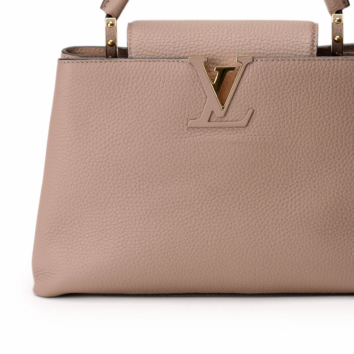 Louis Vuitton beige grained leather handbag with gold LV logo, curated Pre-loved Luxury by Myluxe in Helsinki.