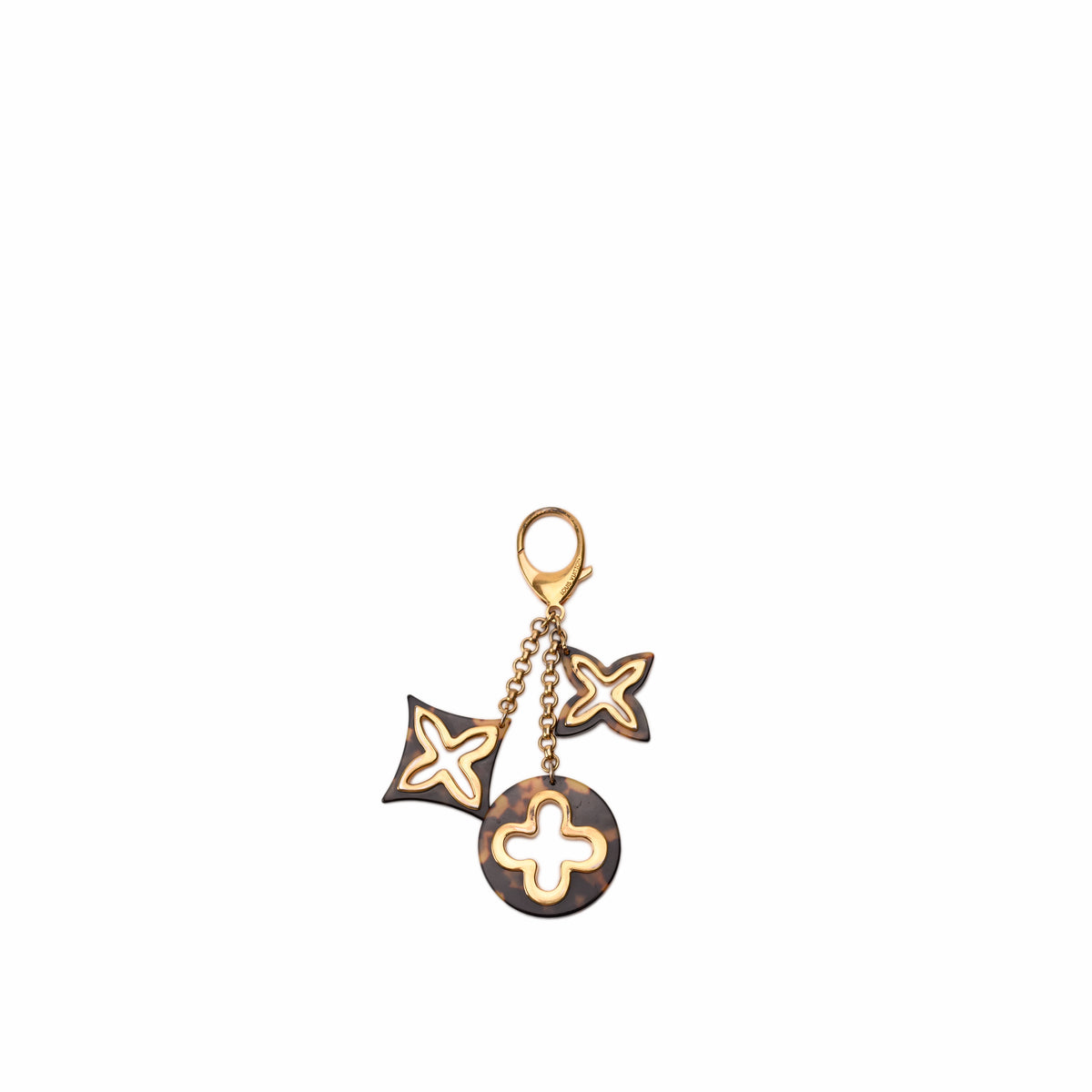 Louis Vuitton brown tortoiseshell resin bag charm with gold-tone hardware, curated Pre-loved Luxury by Myluxe in Helsinki.