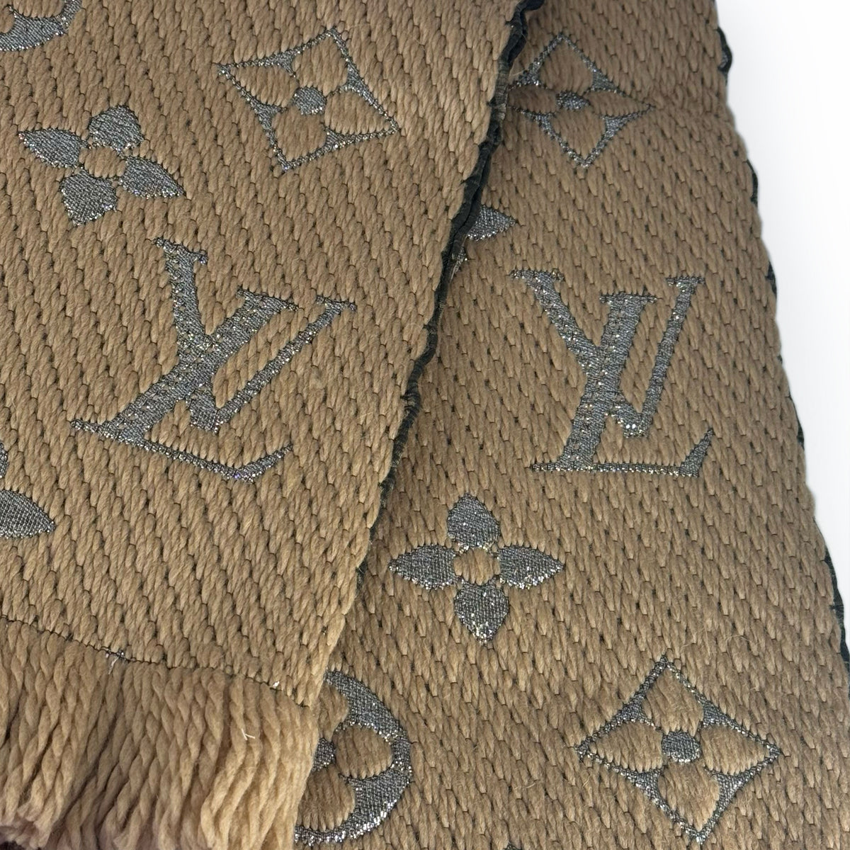 Tan textured fabric with silver Louis Vuitton monogram pattern, curated Pre-loved Luxury by Myluxe in Helsinki.
