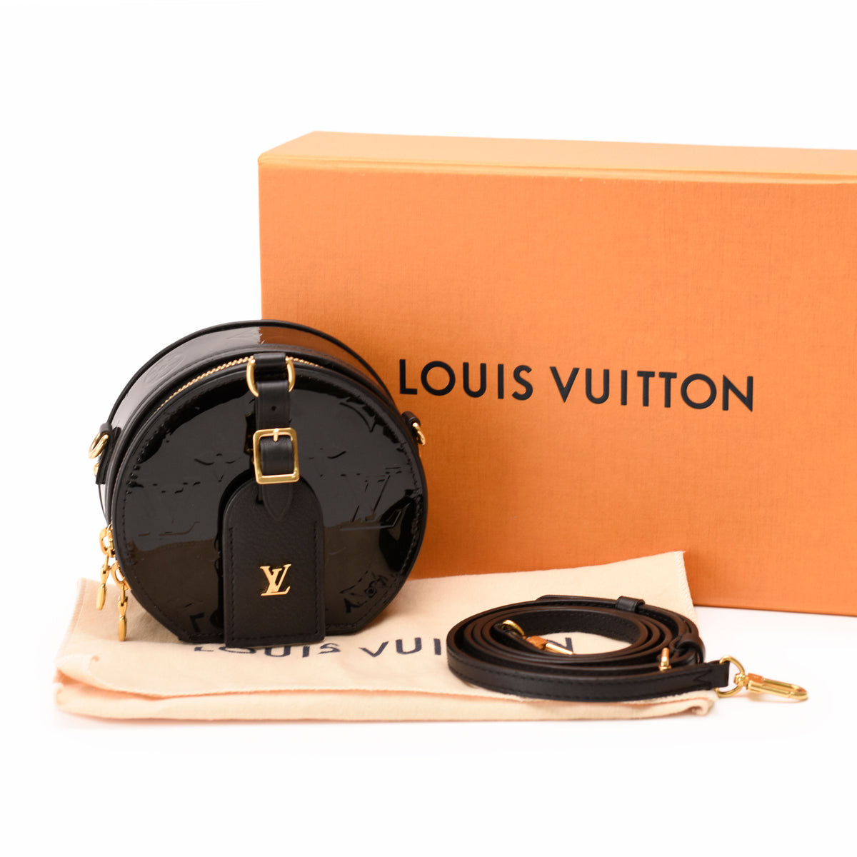 Black patent leather Louis Vuitton circular crossbody bag with gold hardware, curated Pre-loved Luxury by Myluxe in Helsinki.