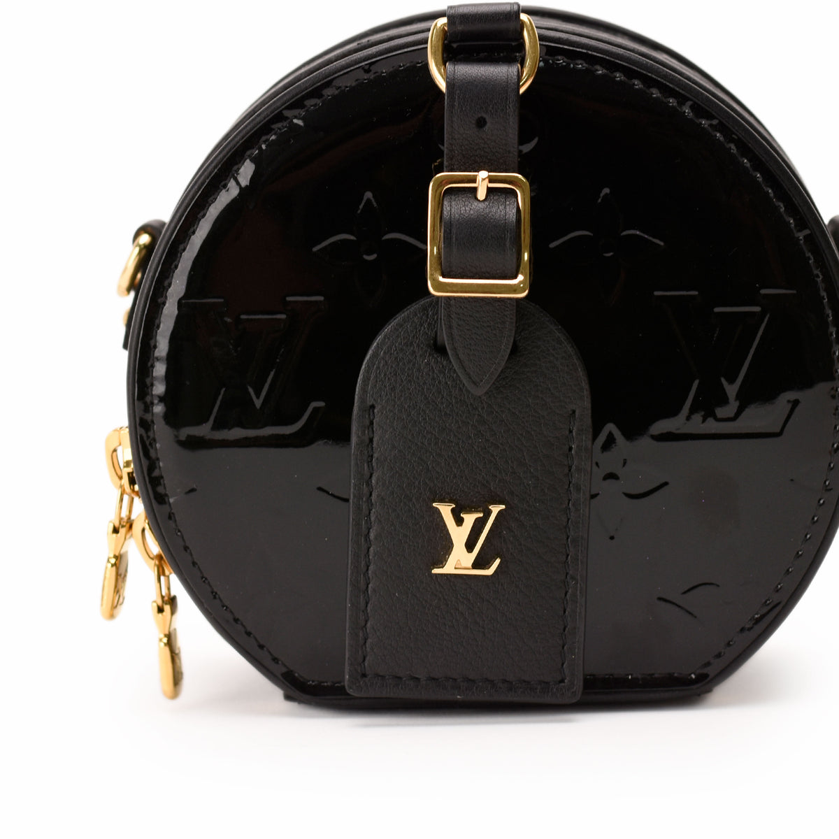 Black patent leather Louis Vuitton circular crossbody bag with gold-tone hardware, curated Pre-loved Luxury by Myluxe in Helsinki.