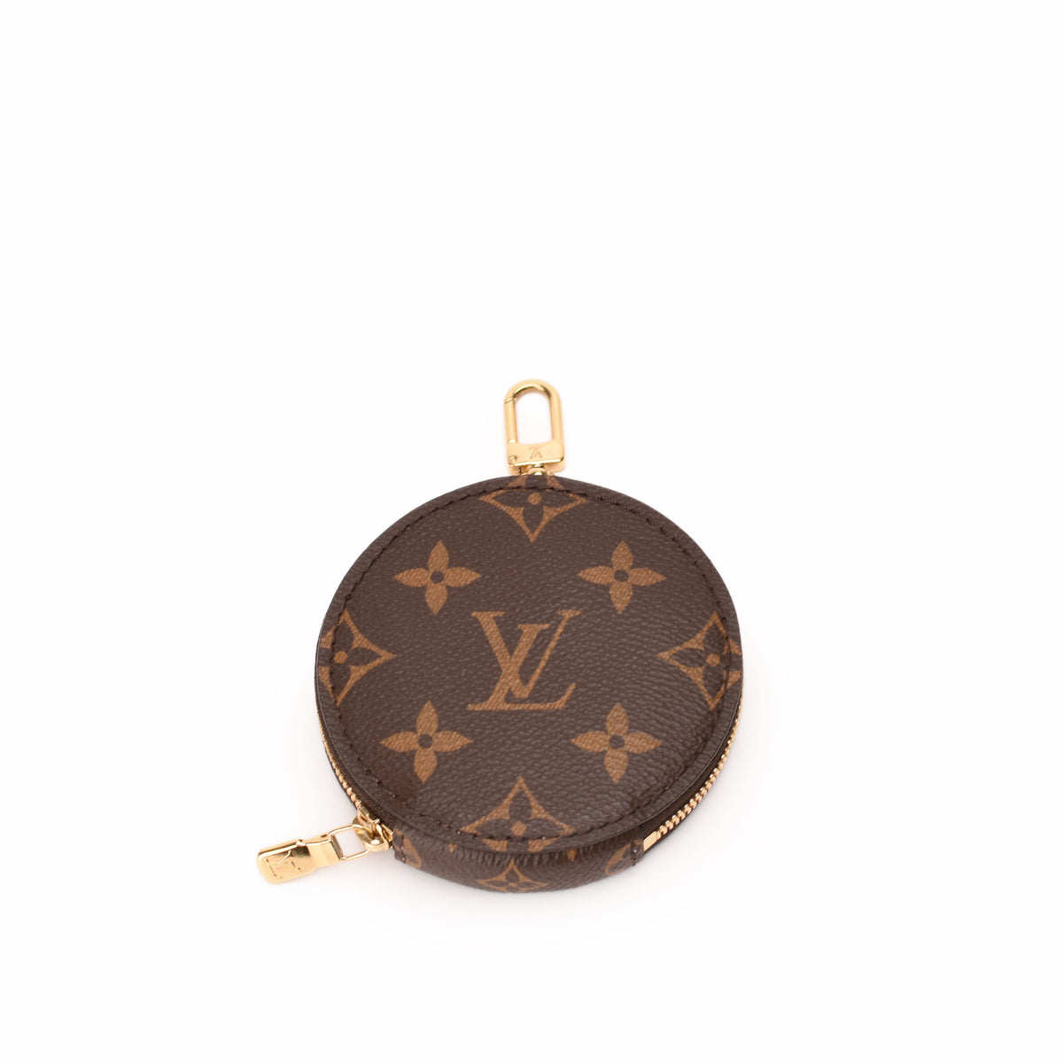 Louis Vuitton Monogram canvas round coin purse in brown with gold-tone hardware. curated Pre-loved Luxury by Myluxe in Helsinki.