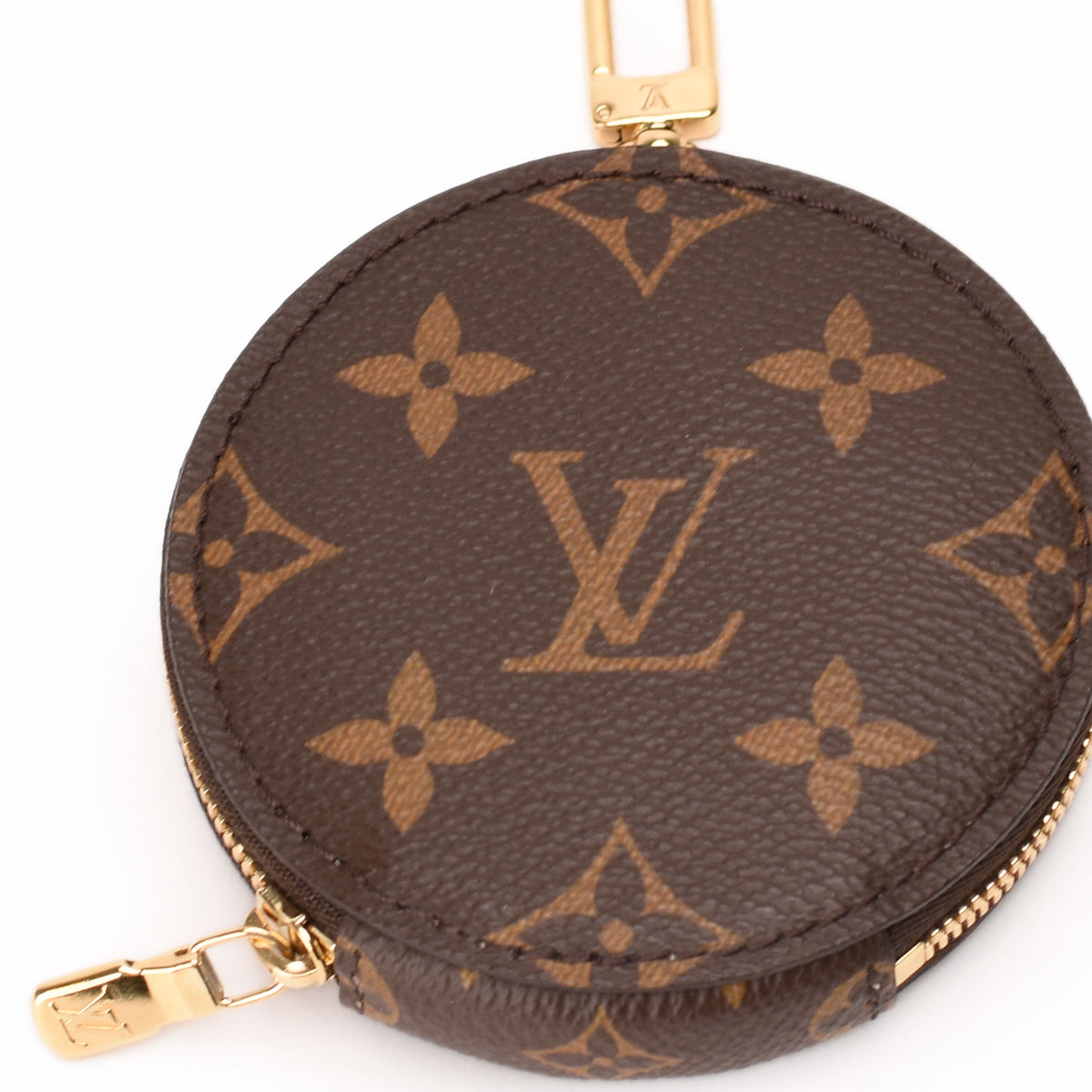 Louis Vuitton brown monogram canvas coin purse with gold-tone hardware. curated Pre-loved Luxury by Myluxe in Helsinki.