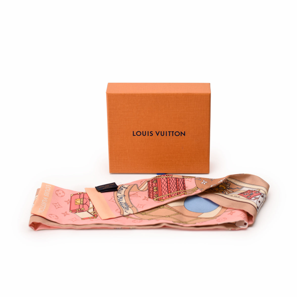 Pink silk Louis Vuitton scarf with illustrative prints and orange box, curated Pre-loved Luxury by Myluxe in Helsinki.