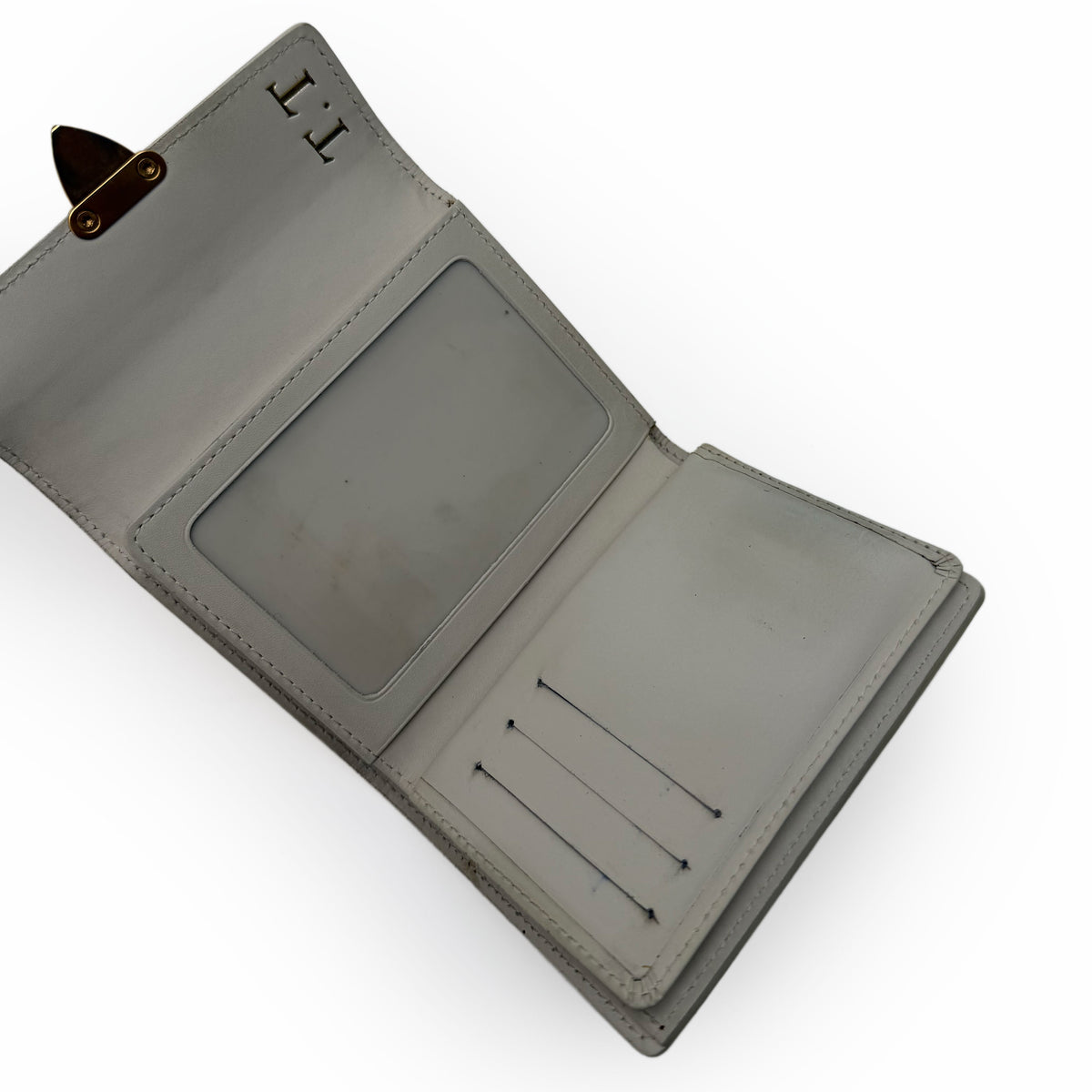 Light grey leather bi-fold wallet with monogrammed T.T. initials, curated Pre-loved Luxury by Myluxe in Helsinki.