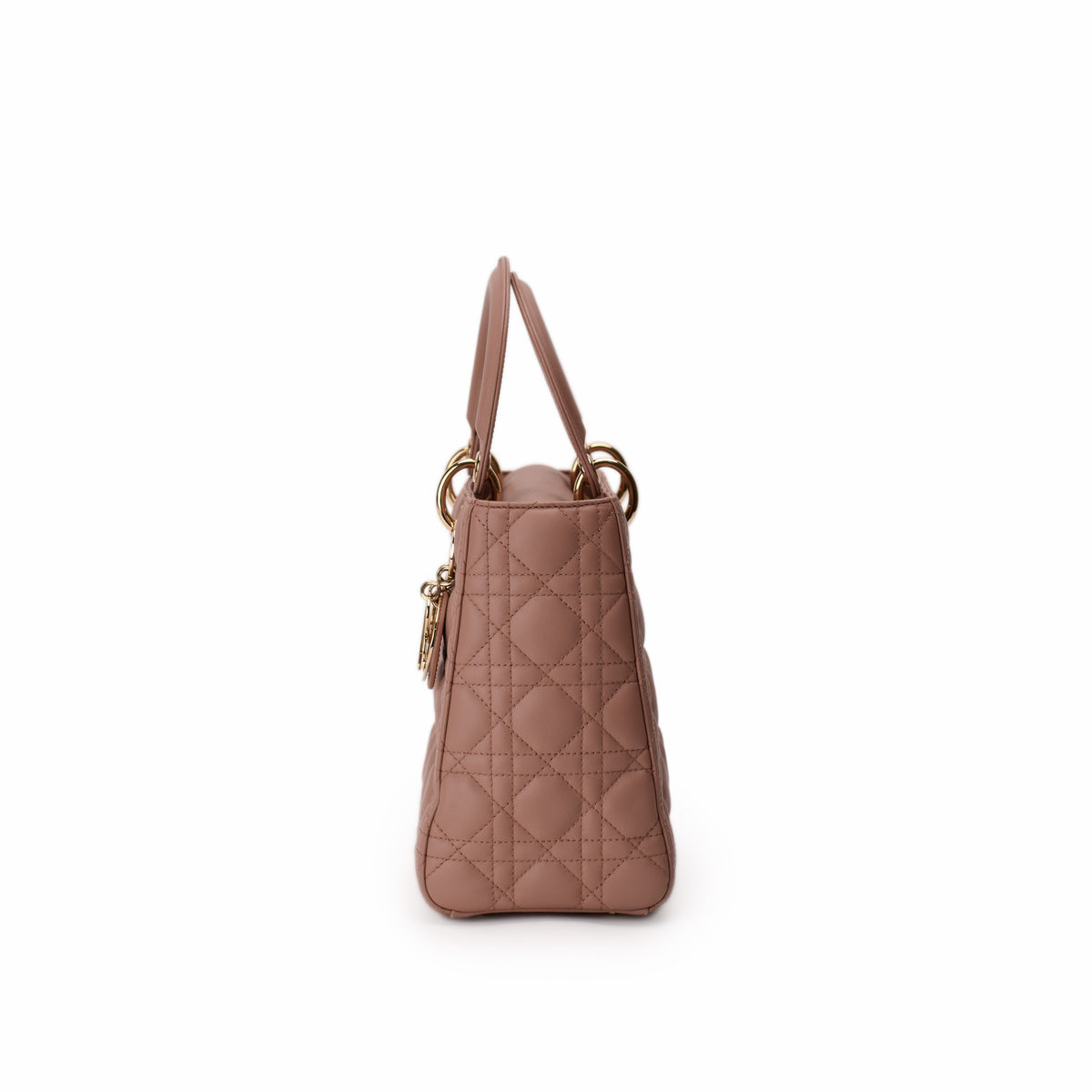 Dusty rose quilted leather Dior handbag with gold-tone hardware, curated Pre-loved Luxury by Myluxe in Helsinki.