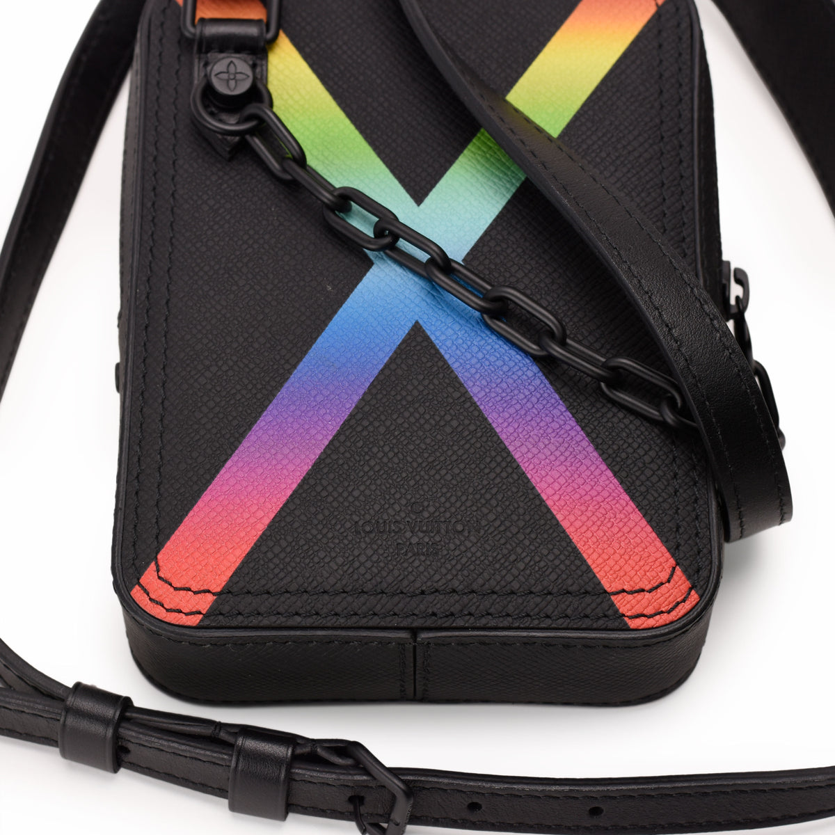Black textured leather Louis Vuitton crossbody bag with rainbow X motif, curated Pre-loved Luxury by Myluxe in Helsinki.