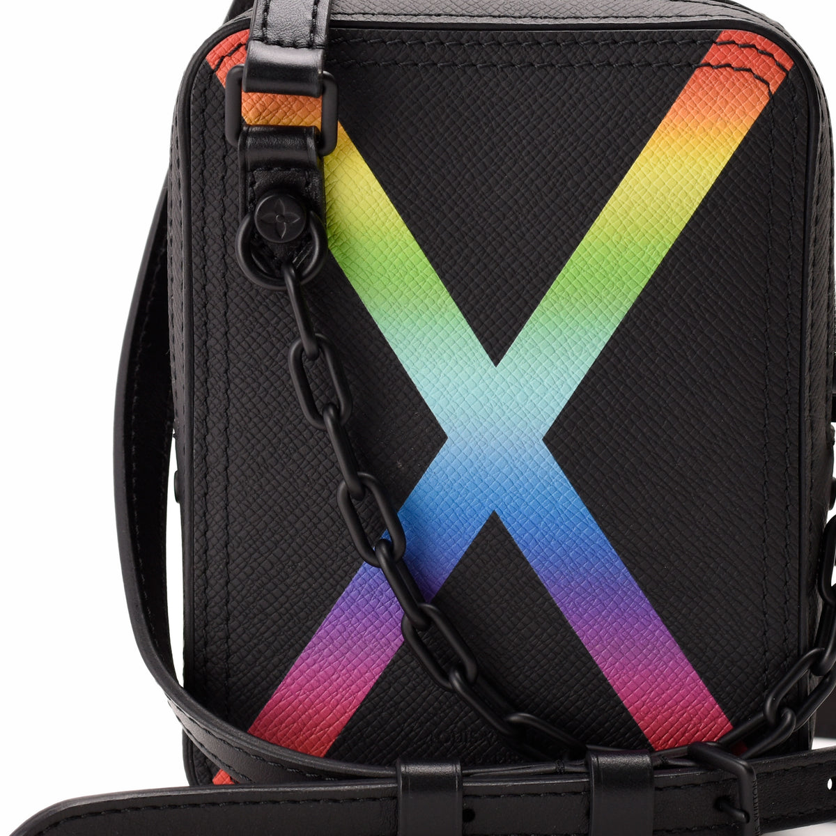 Black textured leather crossbody bag featuring a vibrant rainbow X design, curated Pre-loved Luxury by Myluxe in Helsinki.