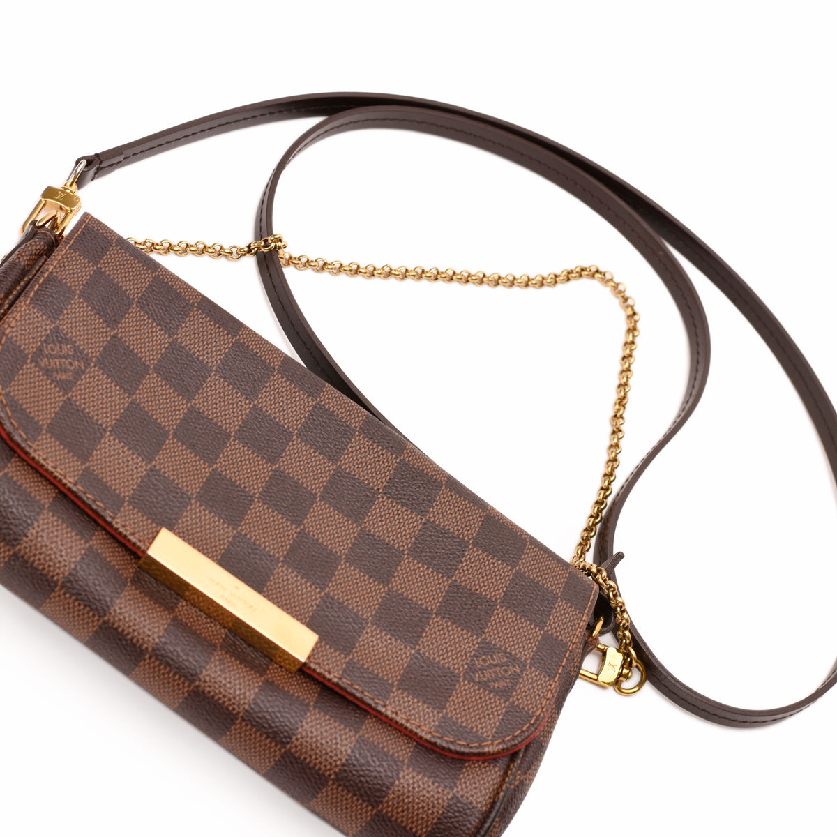Louis Vuitton Damier Ebene checkered canvas crossbody bag with gold-tone hardware. curated Pre-loved Luxury by Myluxe in Helsinki.