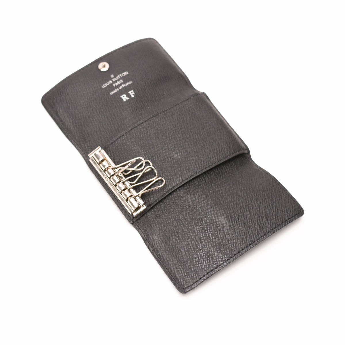 Black textured leather Louis Vuitton ring binder organizer, curated Pre-loved Luxury by Myluxe in Helsinki.
